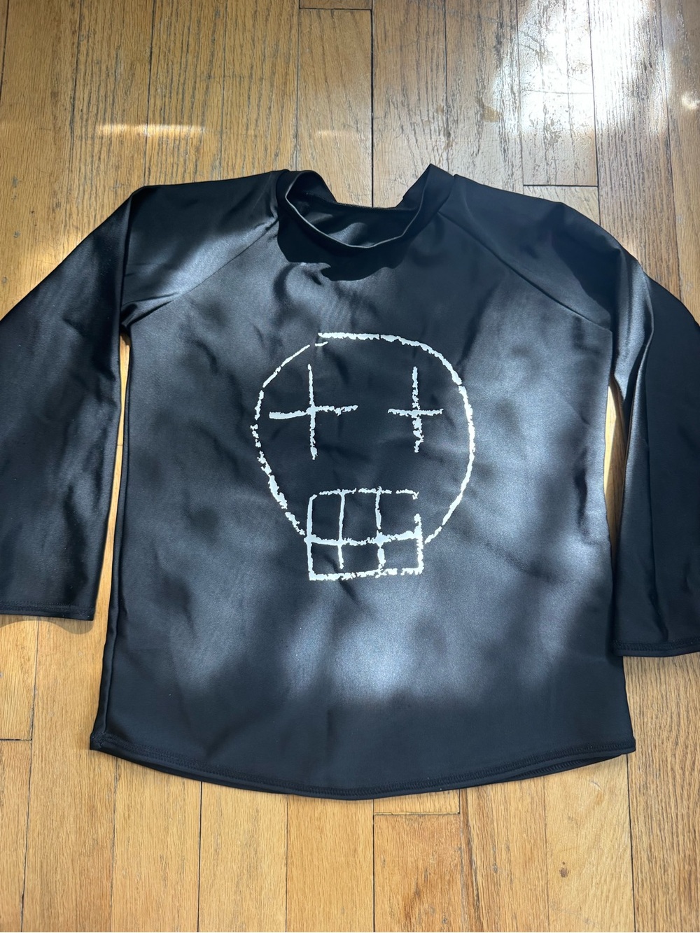 nununu Black Long-Sleeve Swim Rashguard with White Skull Graphic